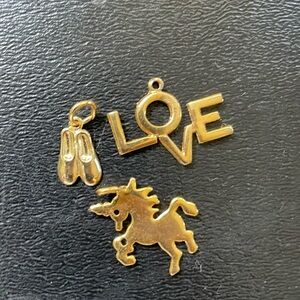 Cute Charms bracelet or necklace. 3 Very sweet gold tone. charms. 3/4”.